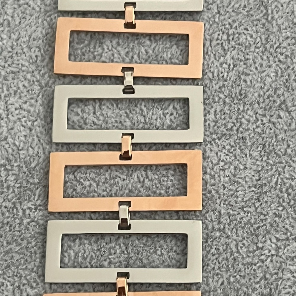 Stainless steel and copper colored cubist hollowed rectangle cast link bracelet